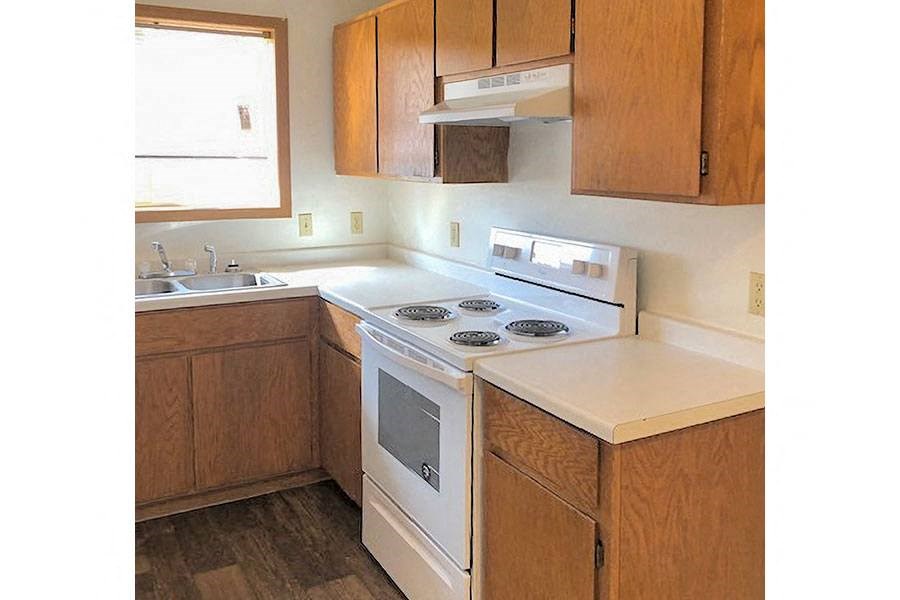 a kitchen with a stove and a sink