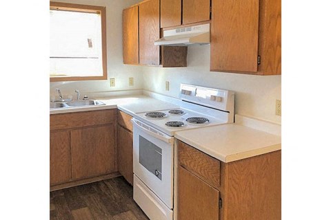a kitchen with a stove and a sink