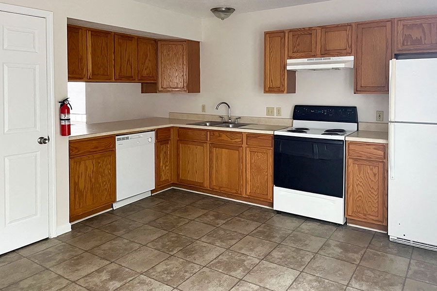 a kitchen with a stove and a refrigerator