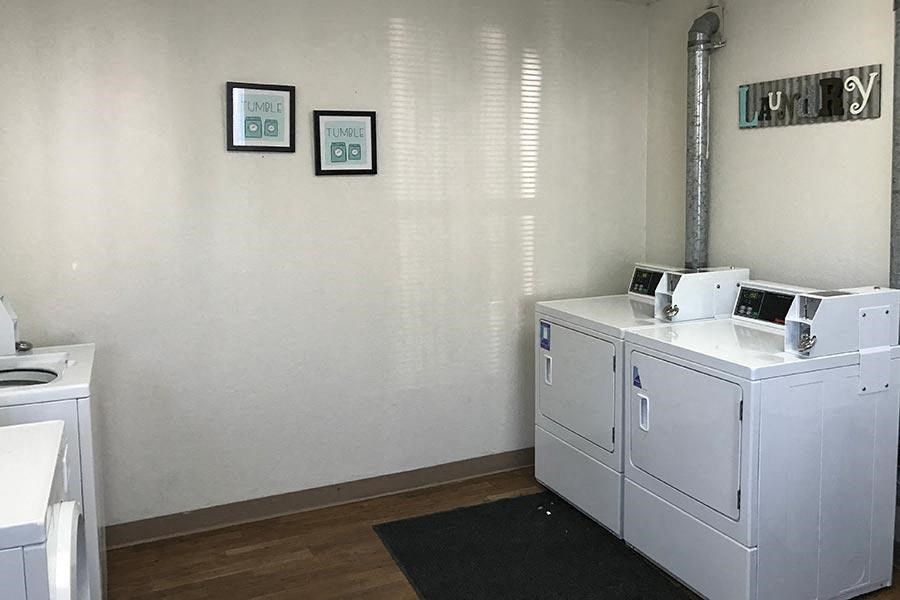 A laundry room with a washer and dryer.
