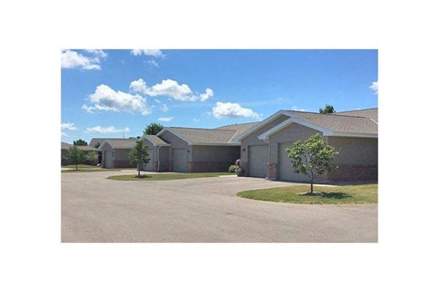 a house with three trees in front of it