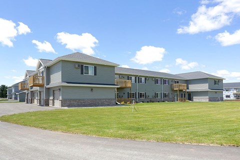 a large house with a yard in front of it
