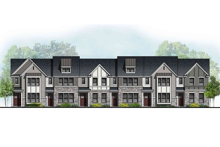 A row of houses with trees in the background.