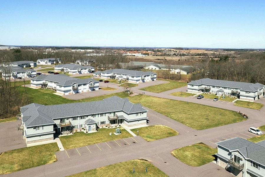 an aerial view of a group of houses in a residential area