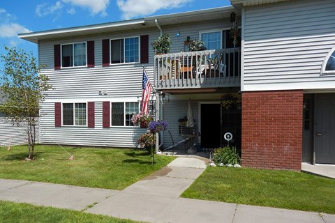 A house with a red and white striped window.