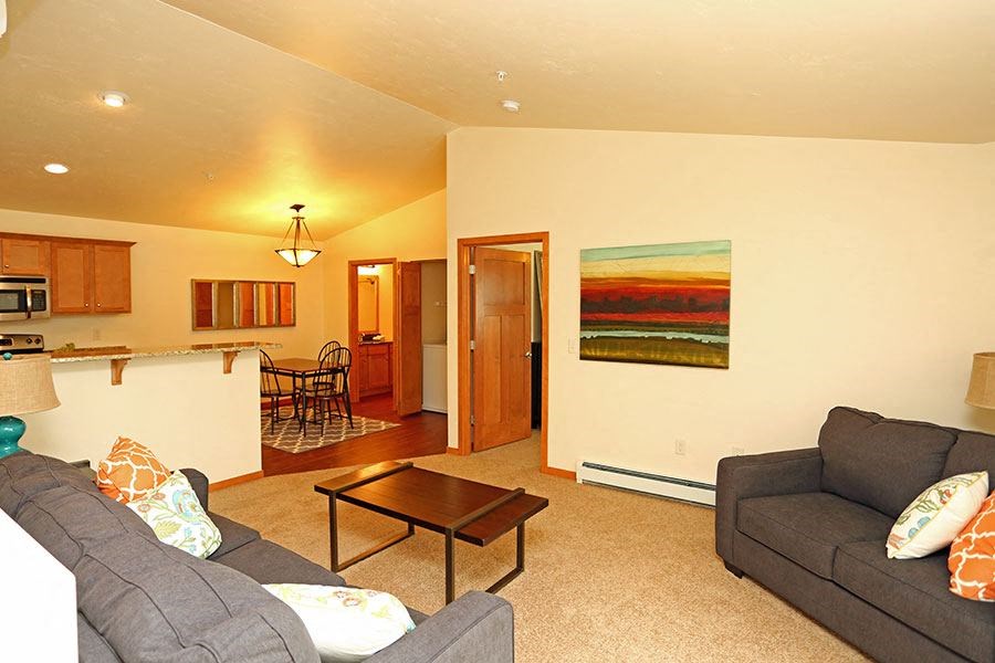 a living room with a couch and a table