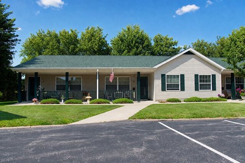 A building with a green roof and a flag on it.
