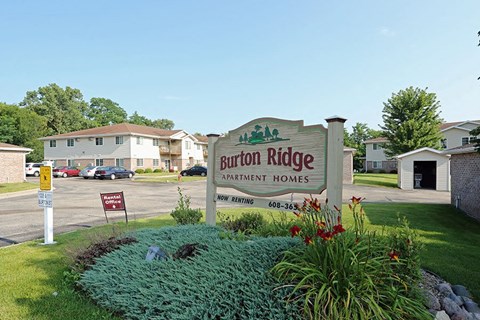 a sign residential homes in front of a parking lot