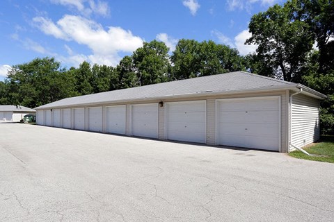 a white garage with a row of white doors