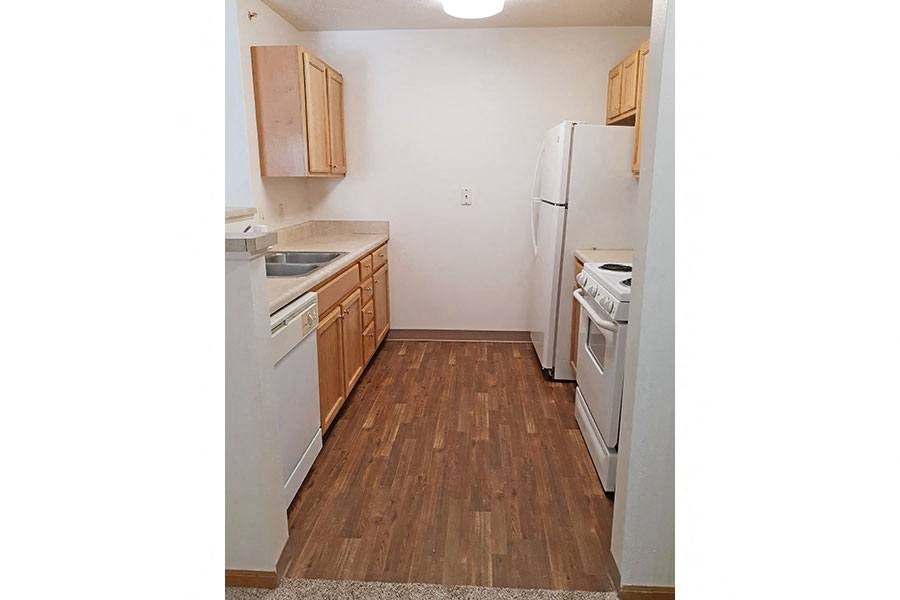 a kitchen with a stove and a refrigerator