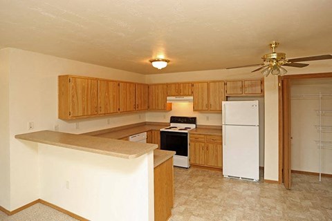 a kitchen with a stove and a refrigerator