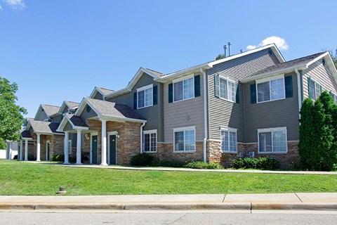a row of houses on the side of a street