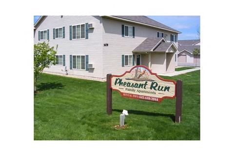 the peach run sign in front of a white house
