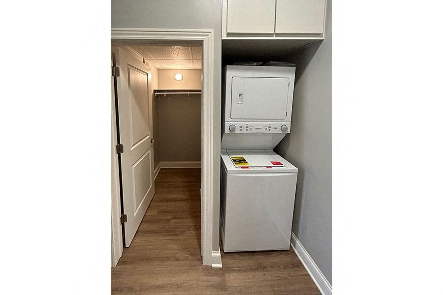 a small kitchen with a washer and dryer in it