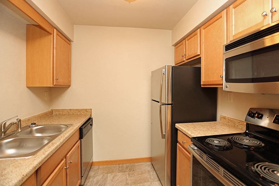a kitchen with a stove and a refrigerator