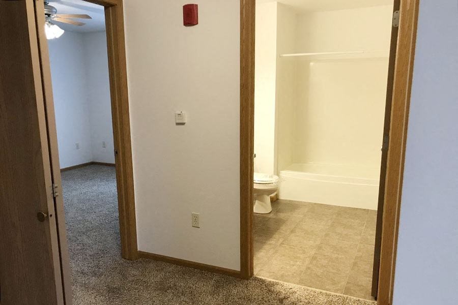 a bathroom with a mirror and a toilet in it