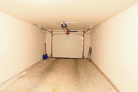 a garage with a large door in the middle of it