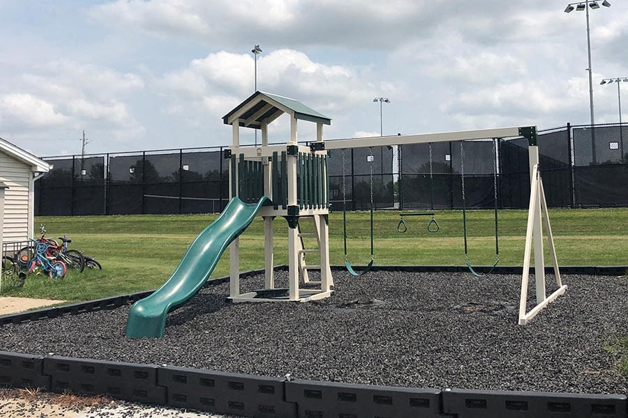 a childrens playground with a slide