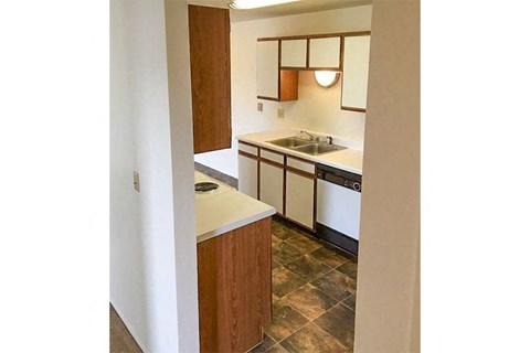 a small kitchen with a stove and a sink