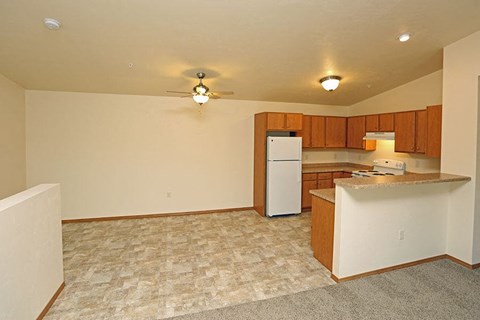 a kitchen with a white refrigerator and a counter top
