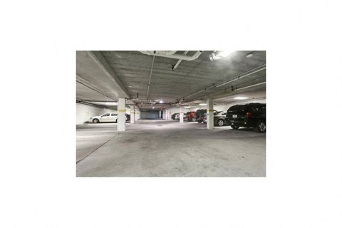a parking garage with cars parked in it