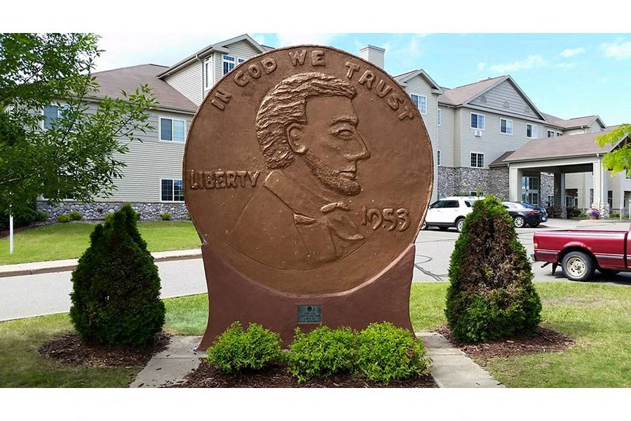 a bronze statue in a yard