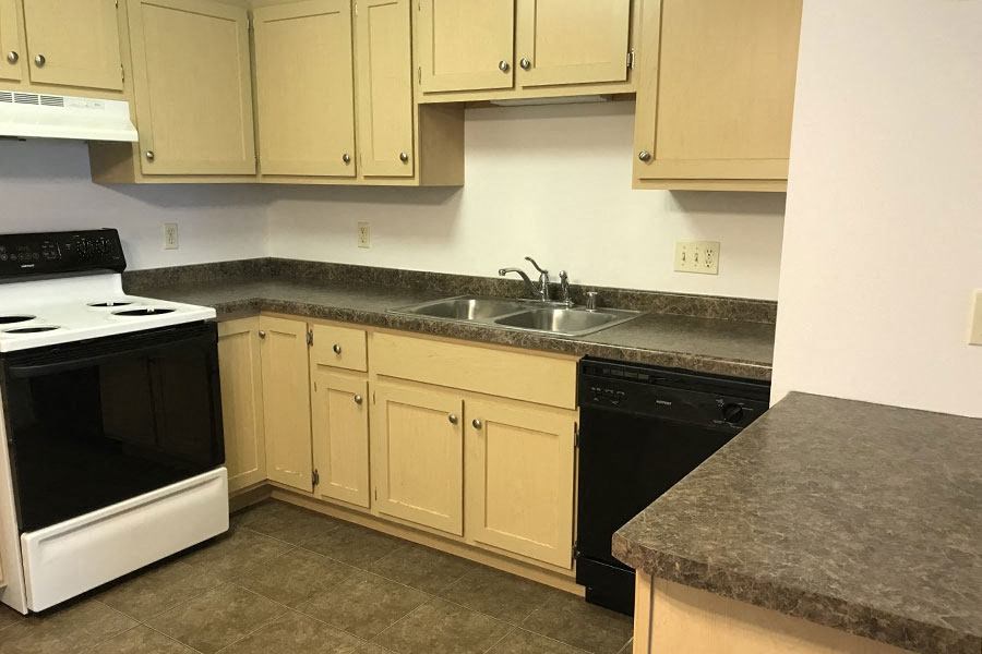 a kitchen with a stove and a sink
