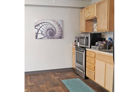 a kitchen with a stove and a sink