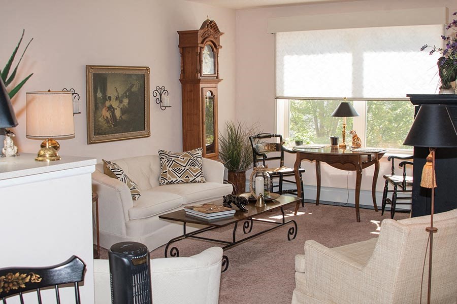 a living room with a couch and a table