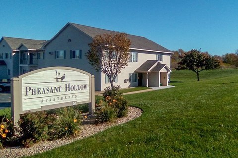 a sign in front of a house