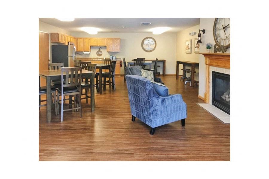 a living room and dining room with a fireplace