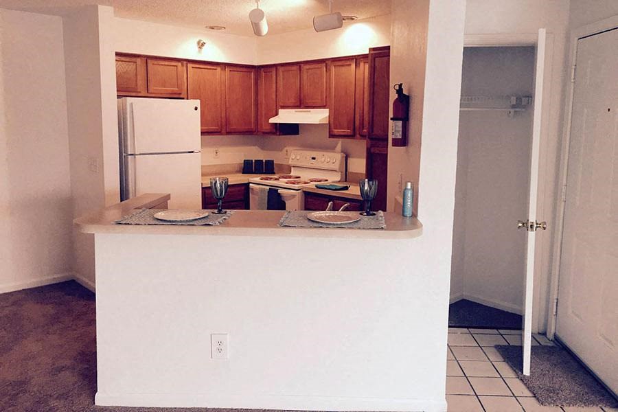 a kitchen with a counter and a refrigerator