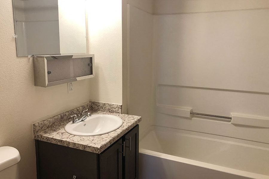 a bathroom with a sink and a bath tub