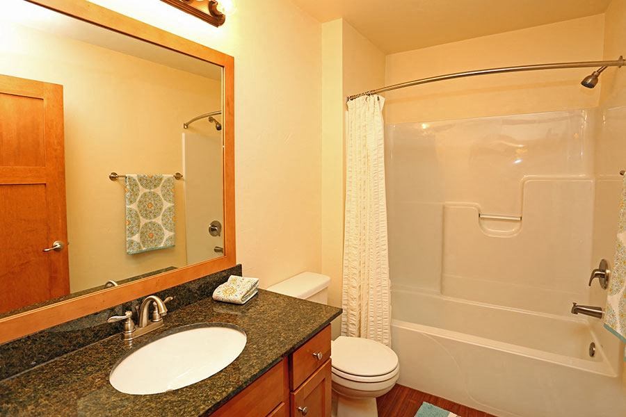 a bathroom with a sink toilet and a shower