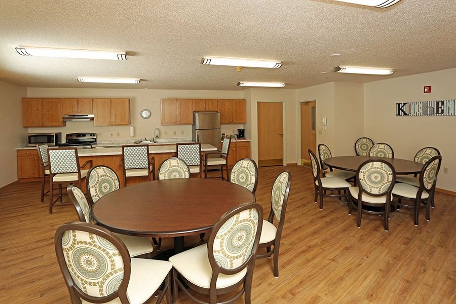 a dining room with a table and chairs