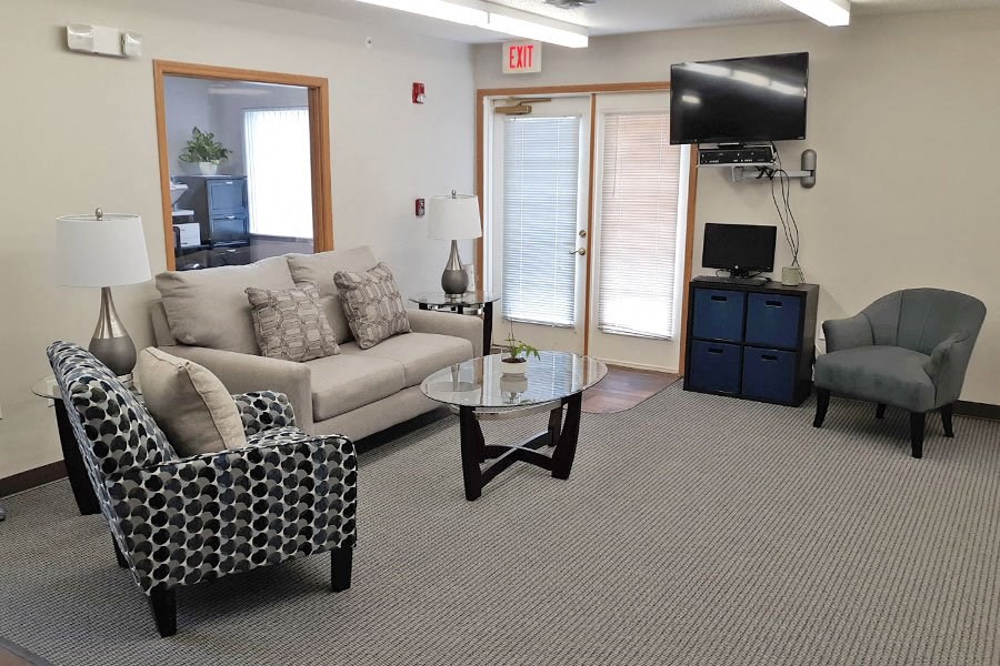 a living room with a couch and a tv