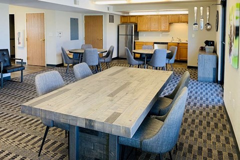a conference room with a large table and chairs