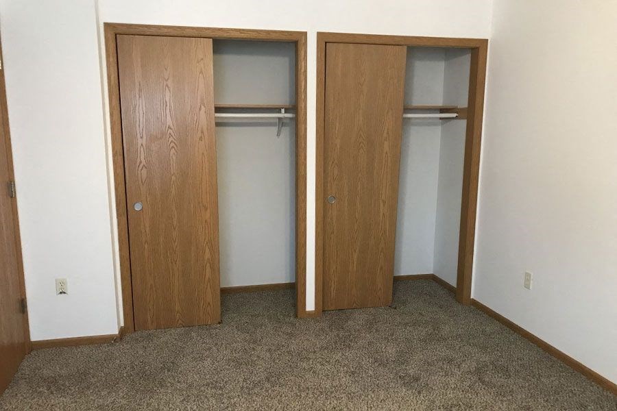 a room with two closet doors in it