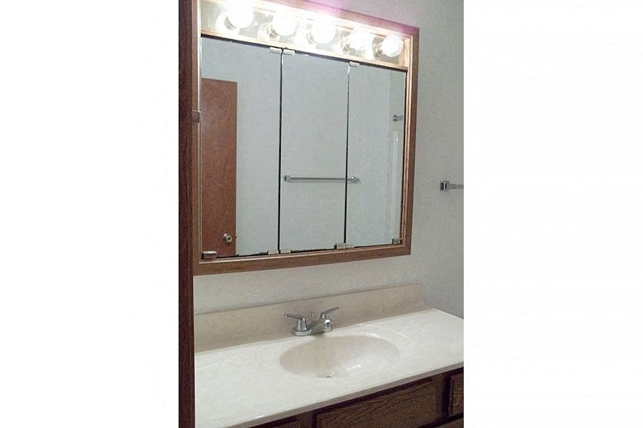 a bathroom with a sink and a mirror