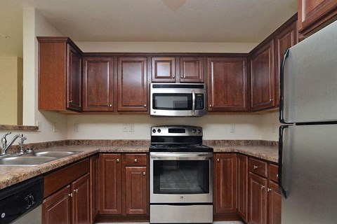 a kitchen with a stove microwave and sink