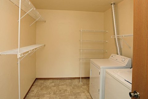 a laundry room with a washer and dryer in it