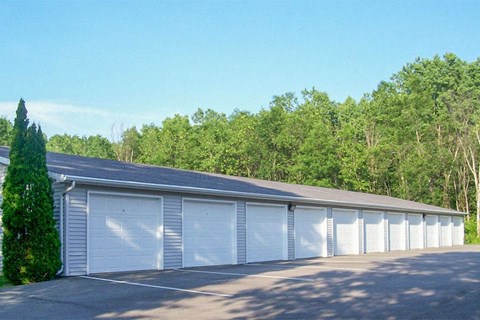 a row of garage doors in a parking lot