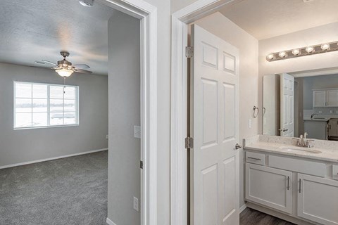 an empty bathroom with a sink and a mirror