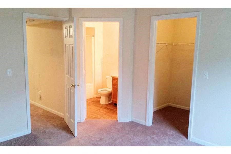 an empty room with a toilet and a bathroom