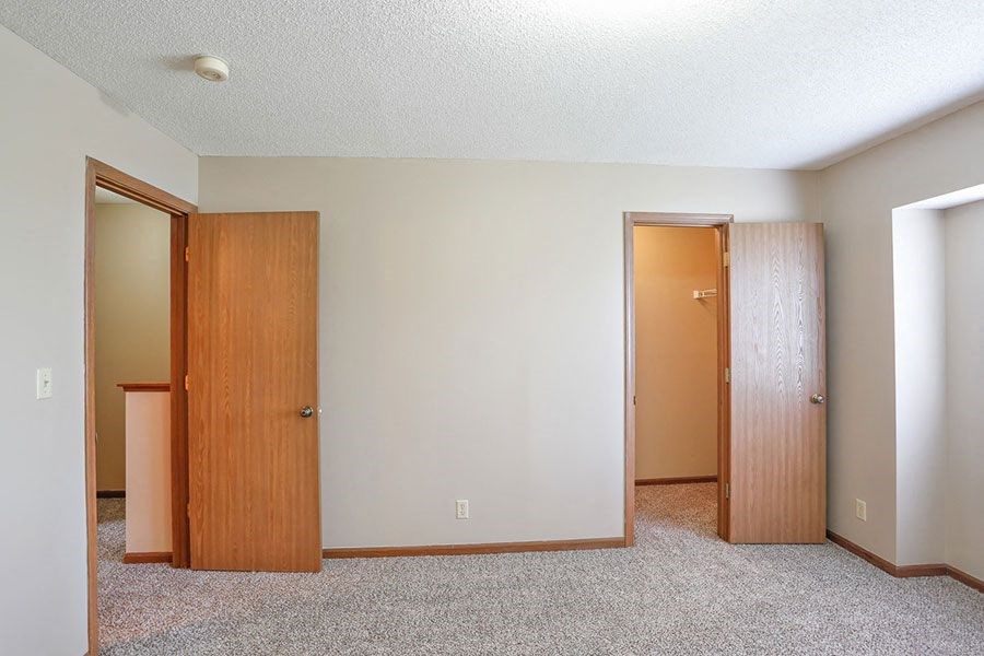 a empty room with two doors in it
