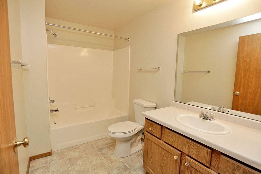a bathroom with a sink toilet and a shower