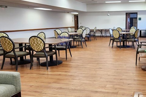 A room with tables and chairs.