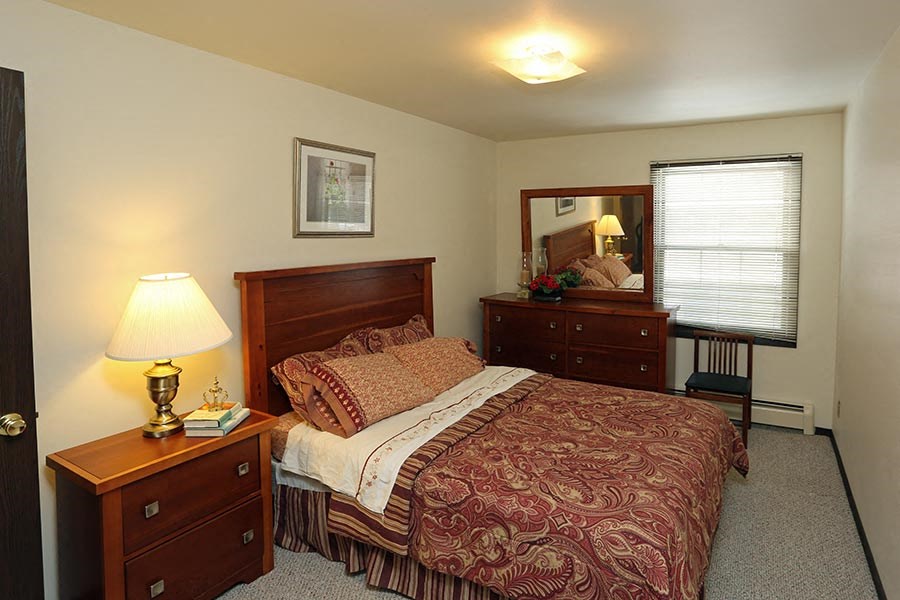 a bedroom with a bed and two night stands