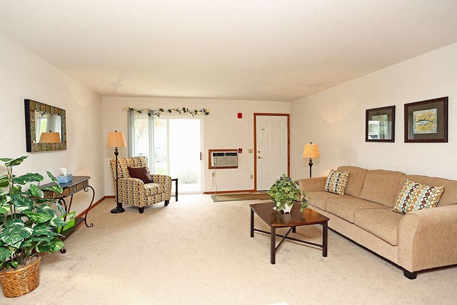 a living room with a couch and a table