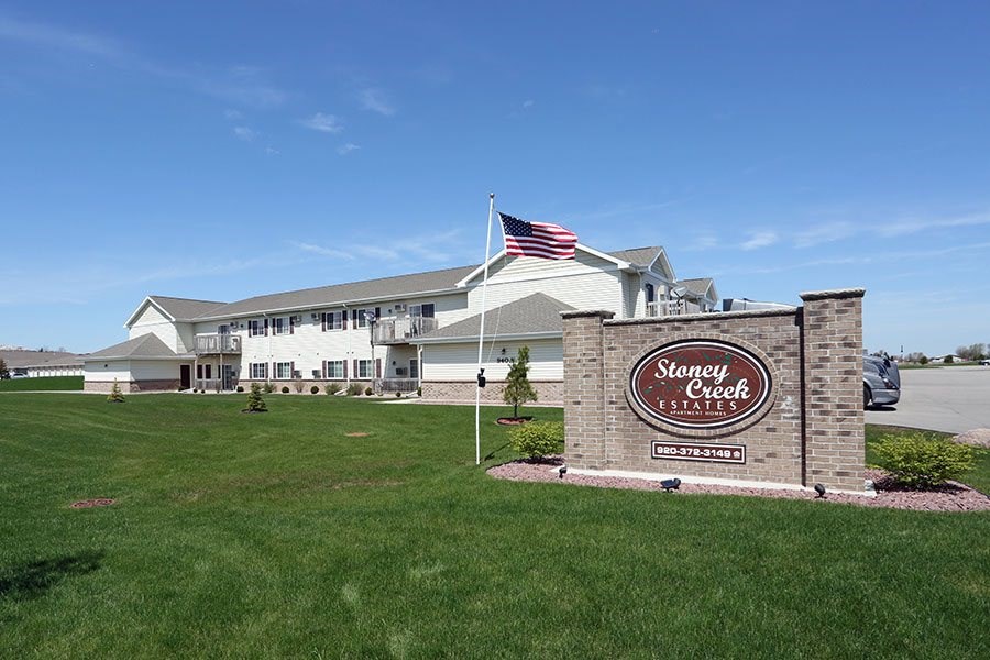 The sign in front of the building says "Stanley Creek Estates.".